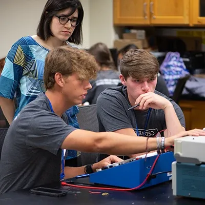 Students in a computer lab working on machines.